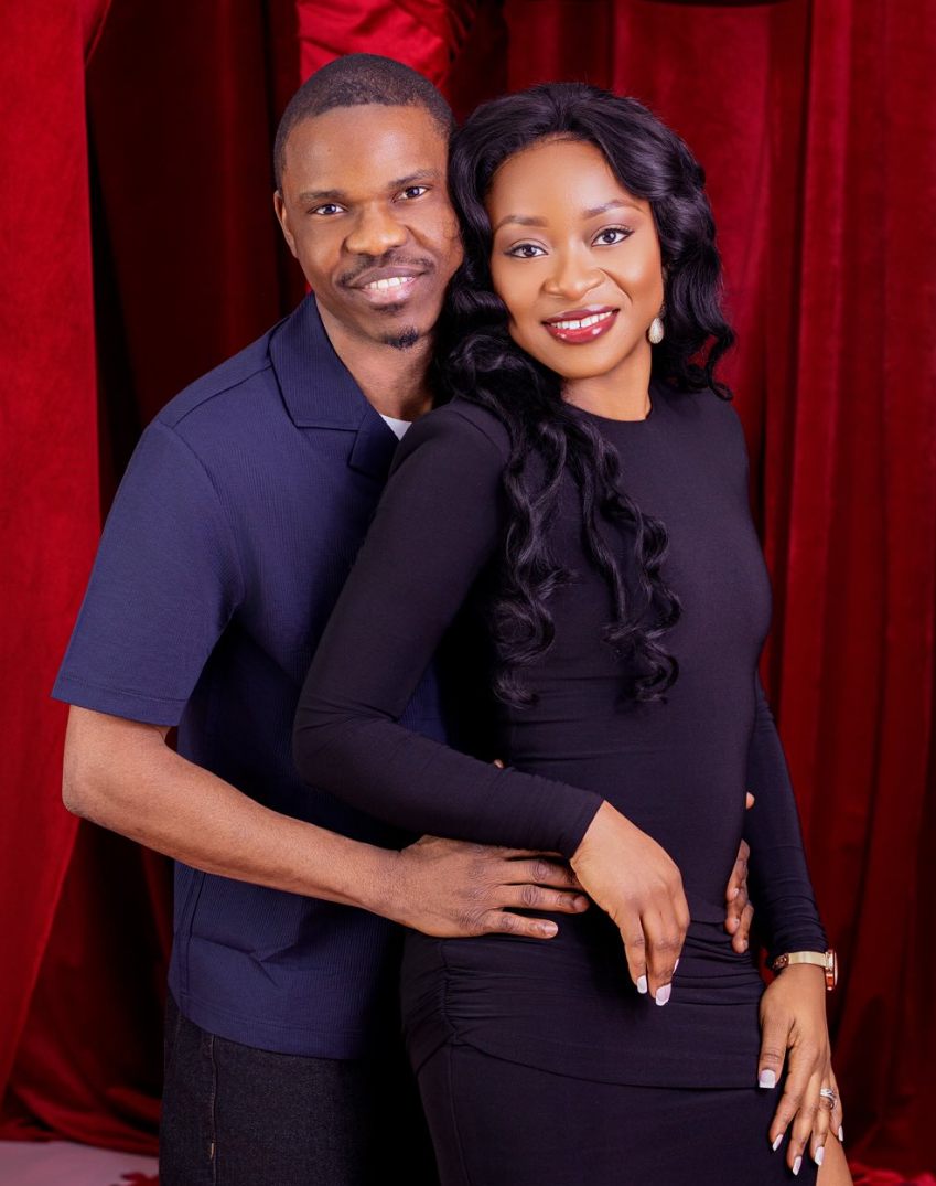 Couple portrait against a deep red velvet backdrop